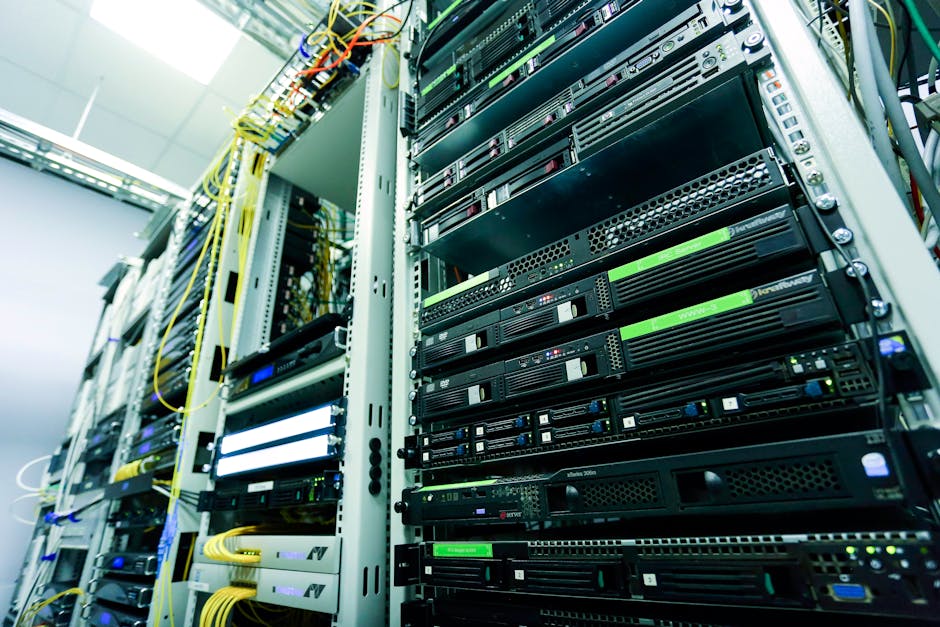 Modern data center with servers and cooling systems, industrial lighting, wide angle shot showing scale and infrastructure
