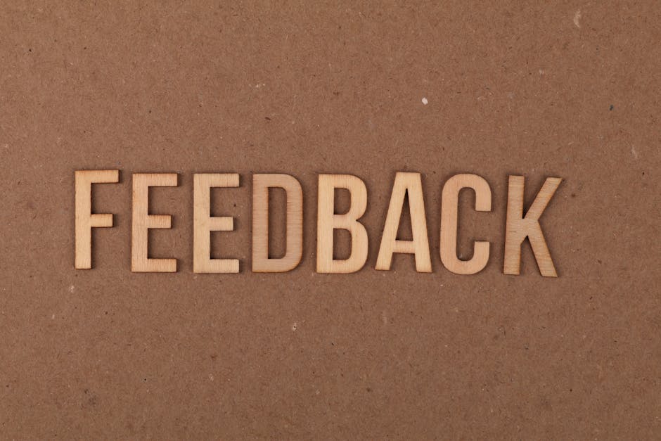 A writer reviewing feedback comments on printed pages with red ink corrections