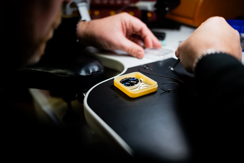 Close-up of hands carefully disassembling a laptop with precision tools on a clean workbench, technical and focused atmosphere, soft natural lighting