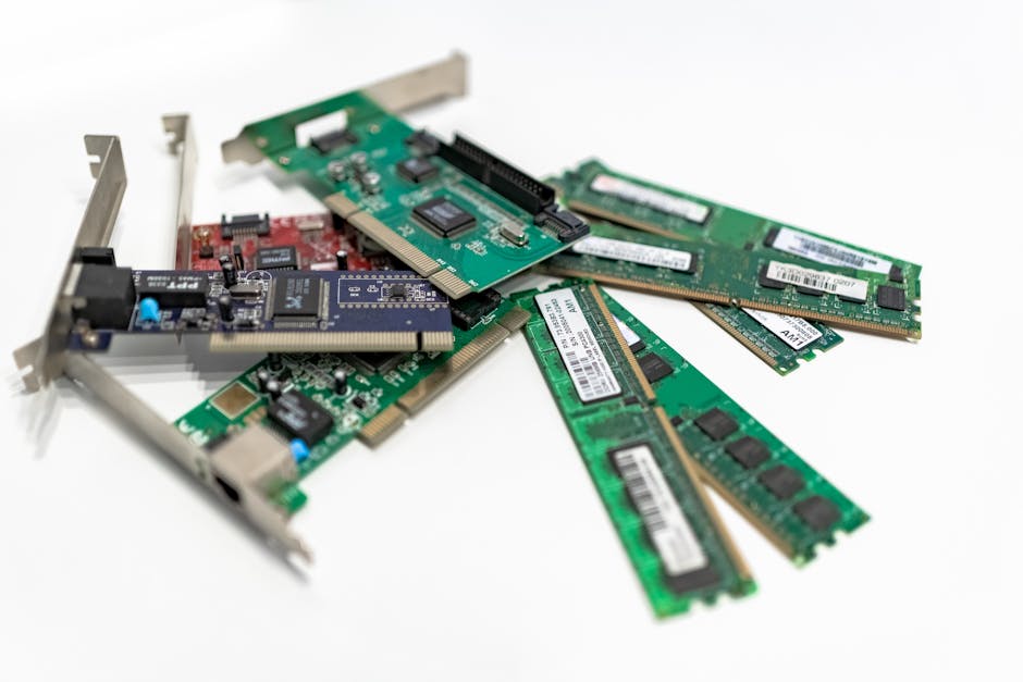 Organized hardware components laid out on a workbench — RAM sticks, SSD, CPU, and motherboard — clean overhead shot, natural light