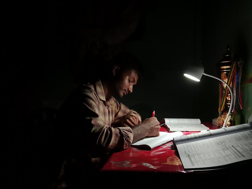 Person studying financial charts and books at a desk late at night, warm lamp light, focused and determined expression, photorealistic