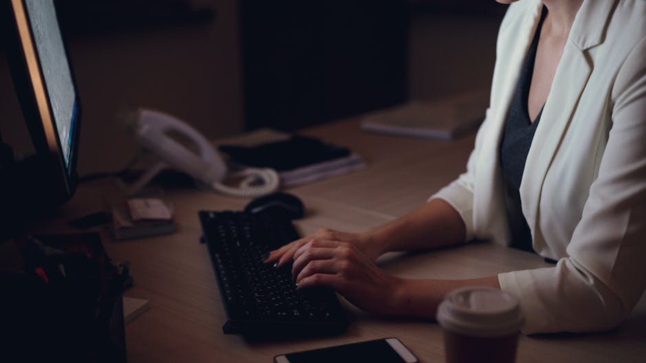 A person at a keyboard late at night, a terminal window open, soft glow of monitors — focused, not frantic
